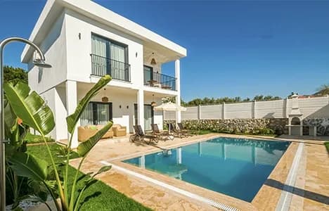 A white house with a swimming pool