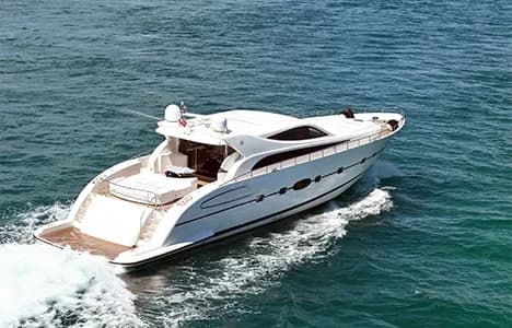 A white motor yacht cruising on the water