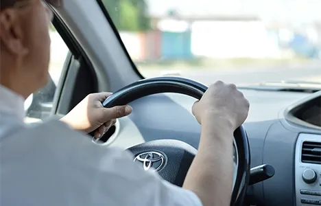 A driver at the wheel of a car